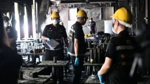 Emergency responders attend the scene of a deadly fire at a Bangkok music venue that claimed more than 30 lives.