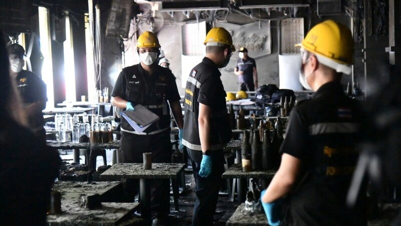 Emergency responders attend the scene of a deadly fire at a Bangkok music venue that claimed more than 30 lives.