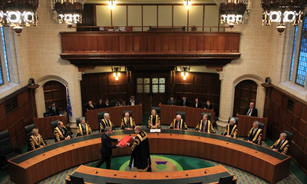 Supreme Court gavel and law books representing judicial practice requirement ruling