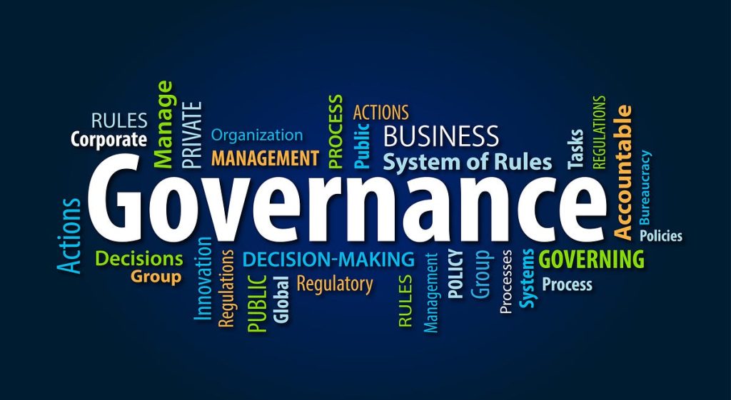 Effective governance meeting showing officials discussing good governance elements and policy decisions
