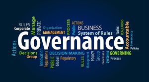 Effective governance meeting showing officials discussing good governance elements and policy decisions