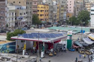 Rows of solar panels covering the rooftop of a house in Multan where families once gathered on summer evenings