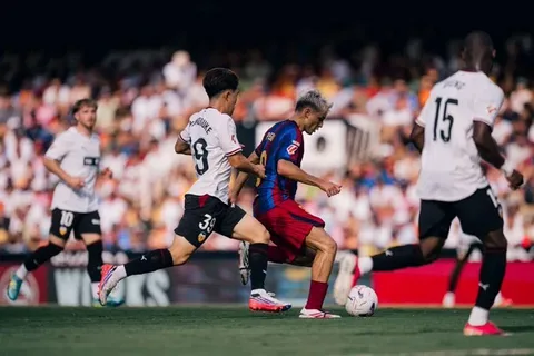 Lamine Yamal celebrating a goal for Barcelona against Valencia at Mestalla