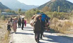 Displaced families from Tirah Valley loading belongings onto trucks during evacuation in Khyber Pakhtunkhwa, Pakistan