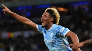 Floyd Samba celebrates scoring twice on his Manchester City debut against Norwich City